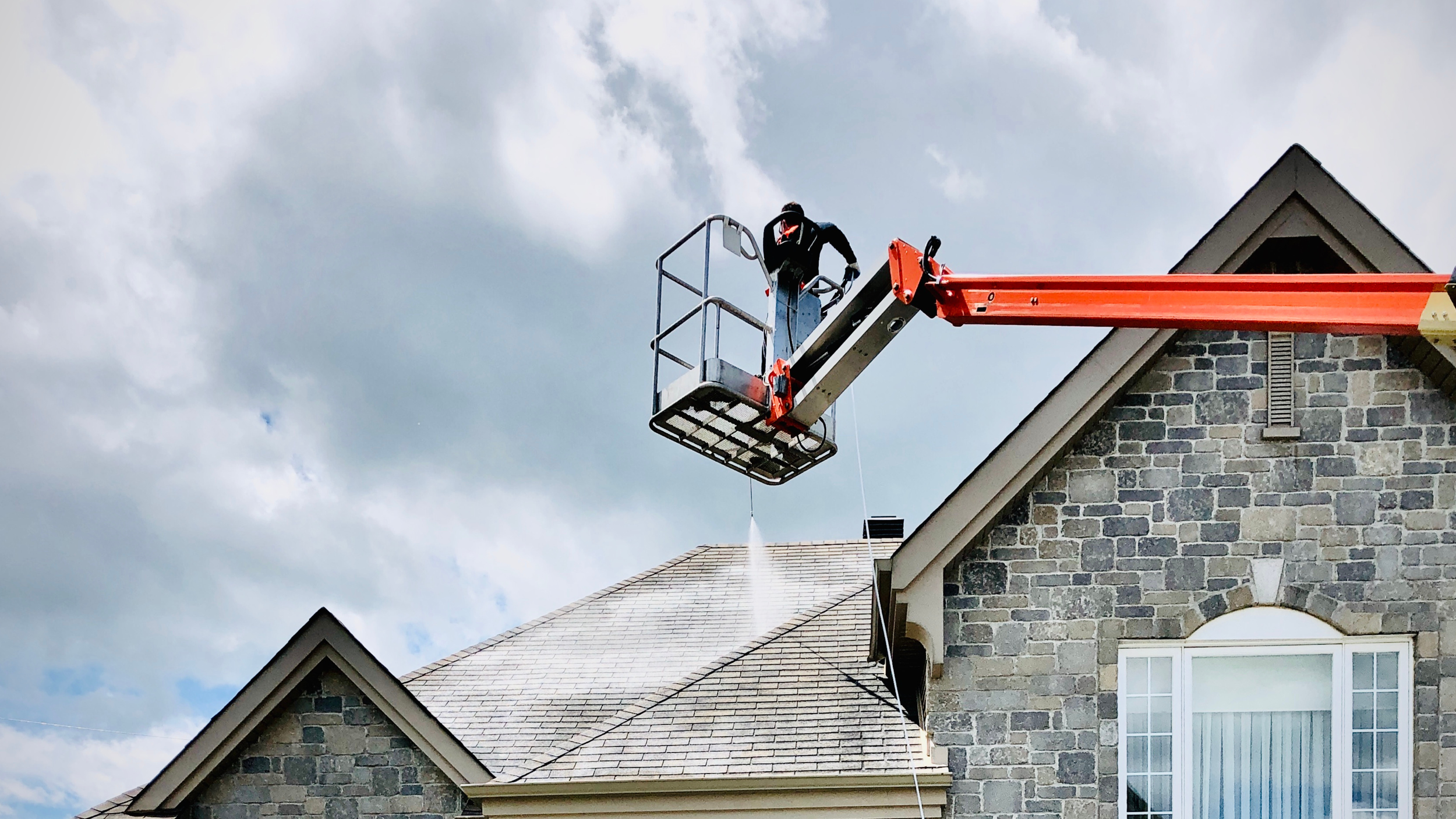 Nano Protection Pros technician applying a protective treatment to a Colorado roof